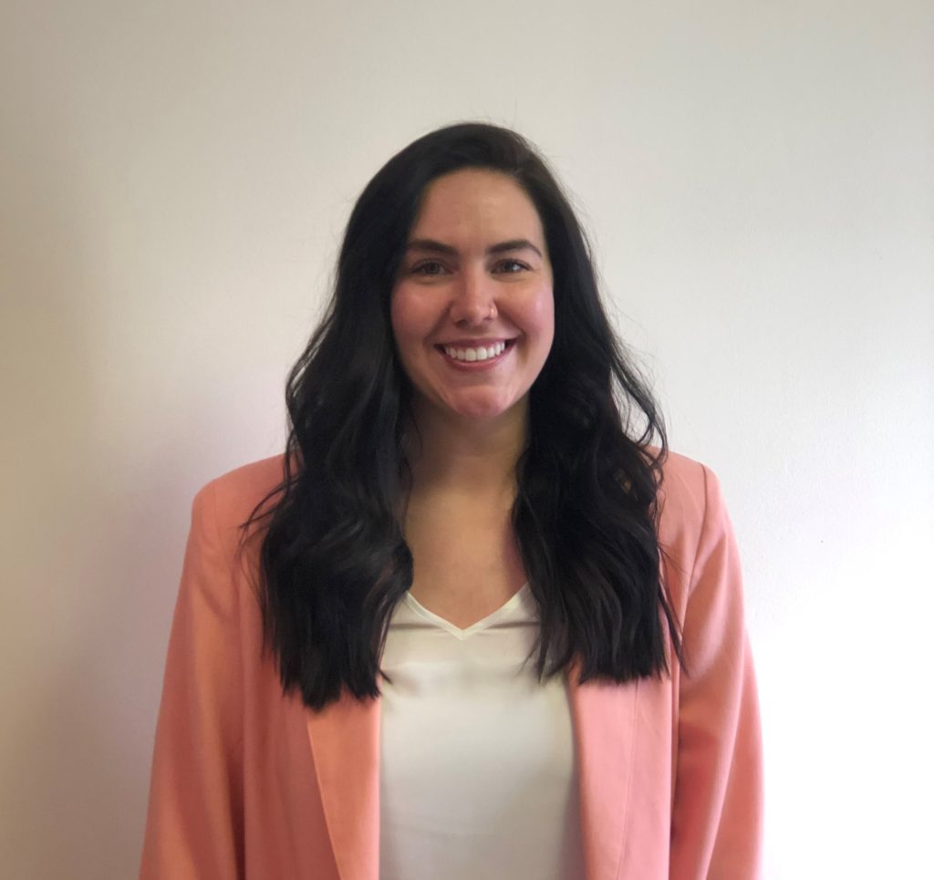 headshot photo of Maddie in pink Jacket